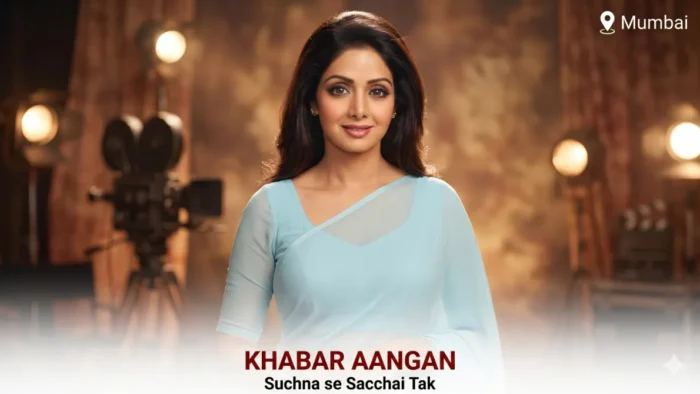 Woman in blue saree, studio backdrop.